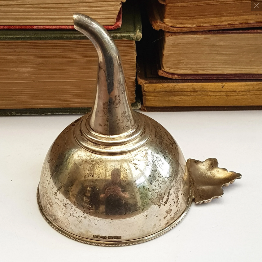 Why is this wine funnel spout bent