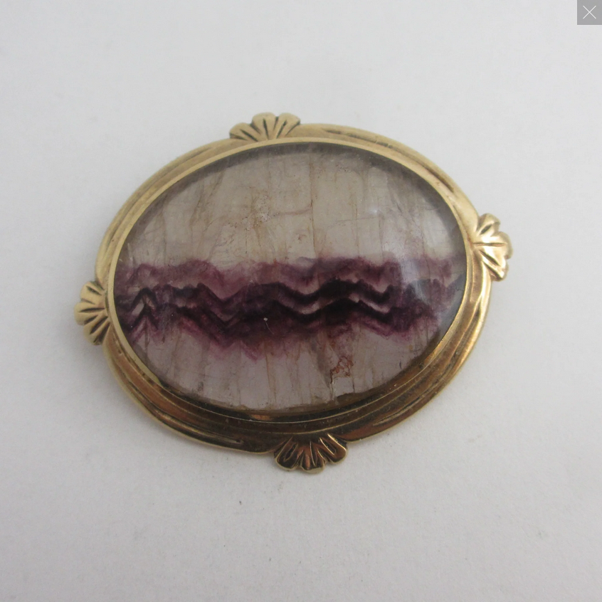 Blue store john brooch