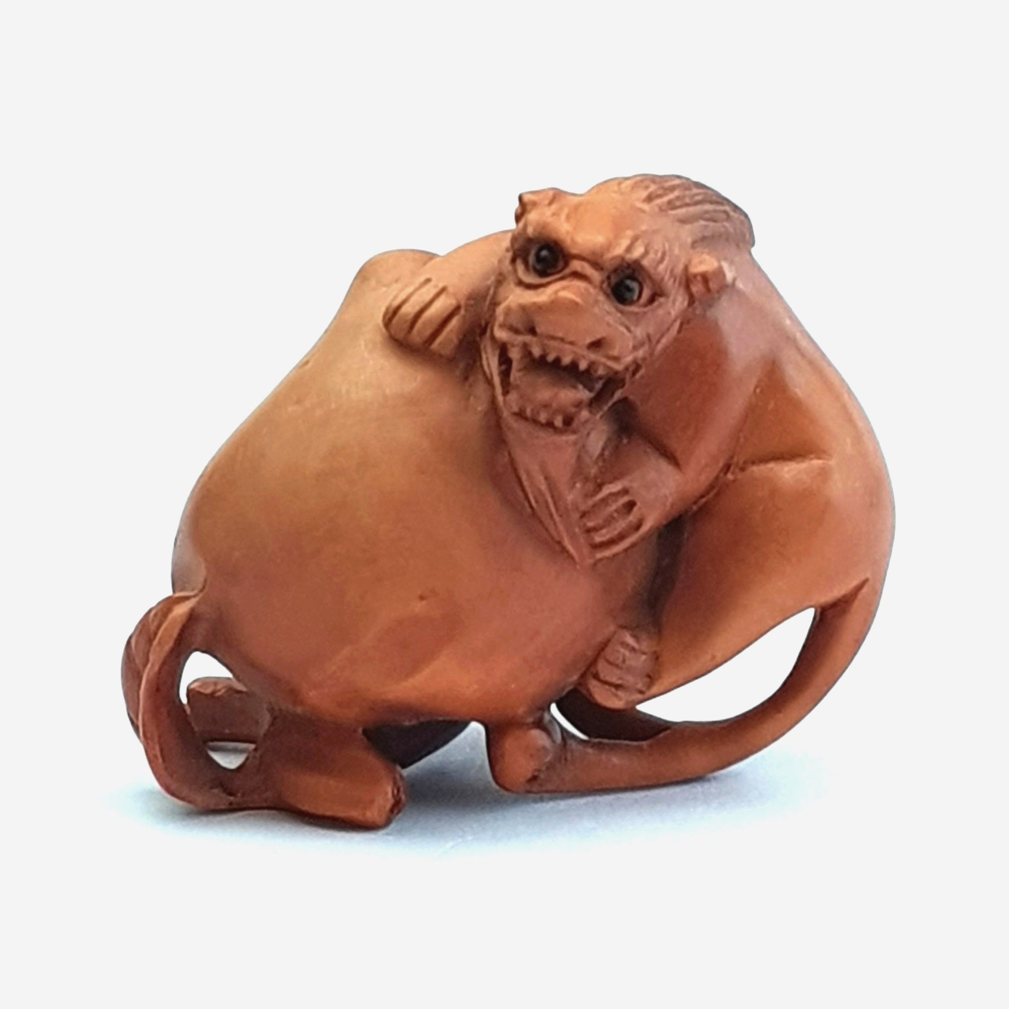 Hand Carved Fruitwood Netsuke Of Foo Lion On Plum Antique Japanese Meiji circa 1880's