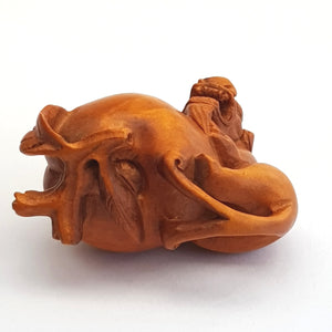 Hand Carved Fruitwood Netsuke Of Foo Lion On Plum Antique Japanese Meiji circa 1880's