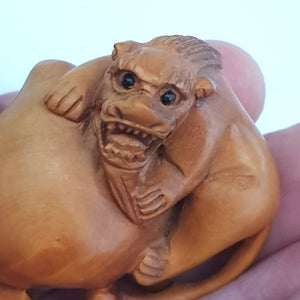 Hand Carved Fruitwood Netsuke Of Foo Lion On Plum Antique Japanese Meiji circa 1880's