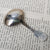 Sterling Silver Shelled Fiddle Pattern Tea Caddy Spoon With Flora Chased Bow Antique Georgian London Circa 1825