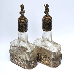 Dutch Sterling Silver Mounted Rare Pair Of Etched And Cut Glass Cherub Stoppered Perfume Bottles Antique Chester Import Circa 1913