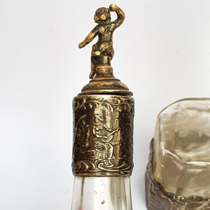 Dutch Sterling Silver Mounted Rare Pair Of Etched And Cut Glass Cherub Stoppered Perfume Bottles Antique Chester Import Circa 1913