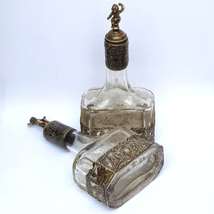 Dutch Sterling Silver Mounted Rare Pair Of Etched And Cut Glass Cherub Stoppered Perfume Bottles Antique Chester Import Circa 1913